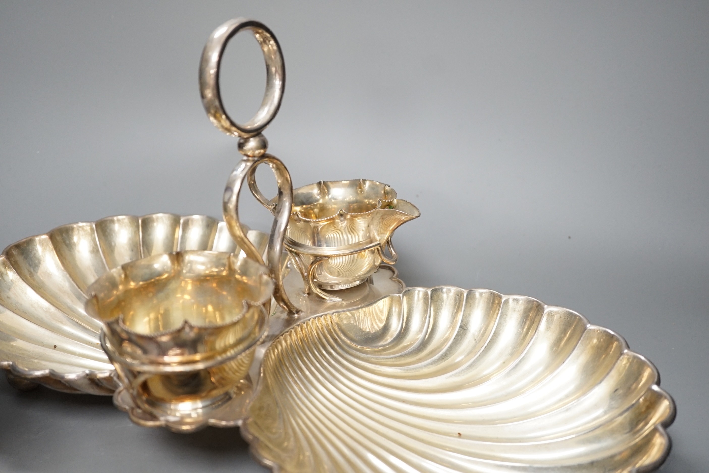 A silver plated strawberry and cream stand with a silver mounted coaster, and a plated biscuit barrel